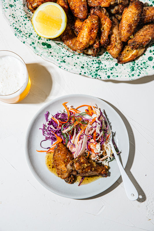 Sticky lemon and pepper wings with rainbow slaw