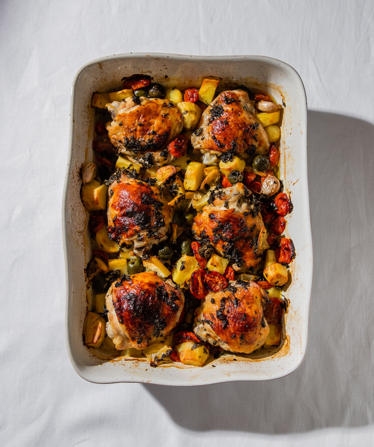 One tray chicken, potato, olive, tomato tray bake