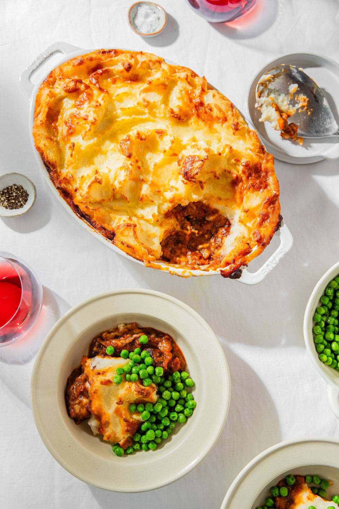 Slow cooked lamb shoulder and tomato, cheesy potato topped pie