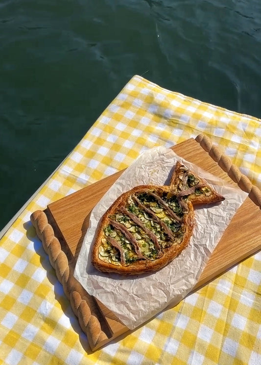 Zucchini, anchovy and herb fish tart