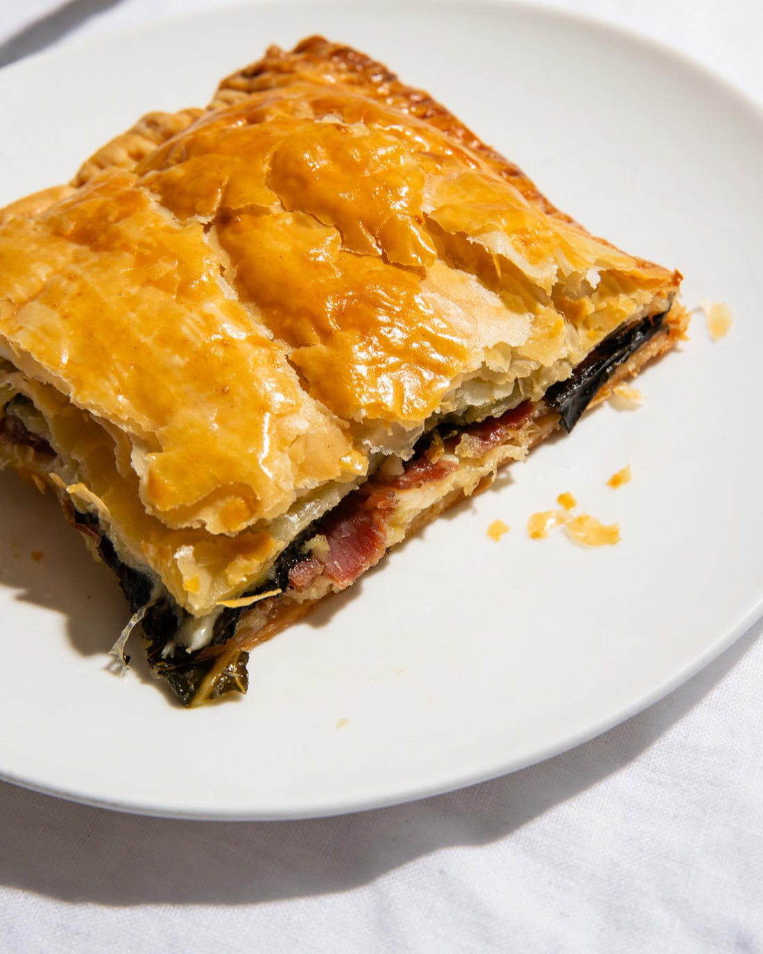 Prosciutto and bitter greens flat pie