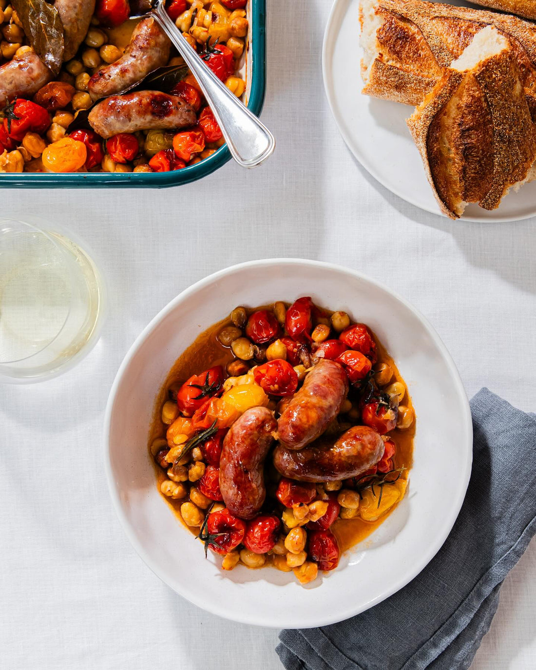 Sausages and tomatoey chickpea tray bake