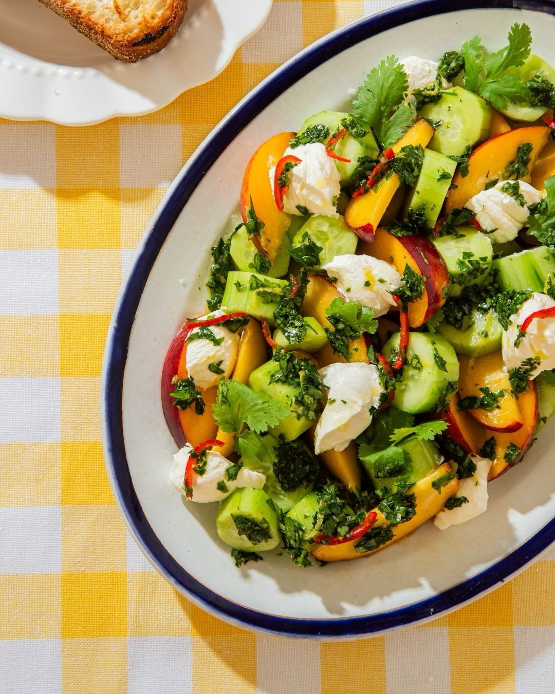 Cucumber, peach and labneh salad with grilled bread
