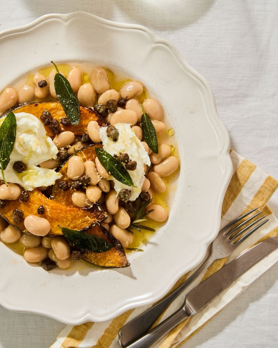 Creamy, brothy beans, roasted pumpkin, mozzarella with a crispy sage and caper topping