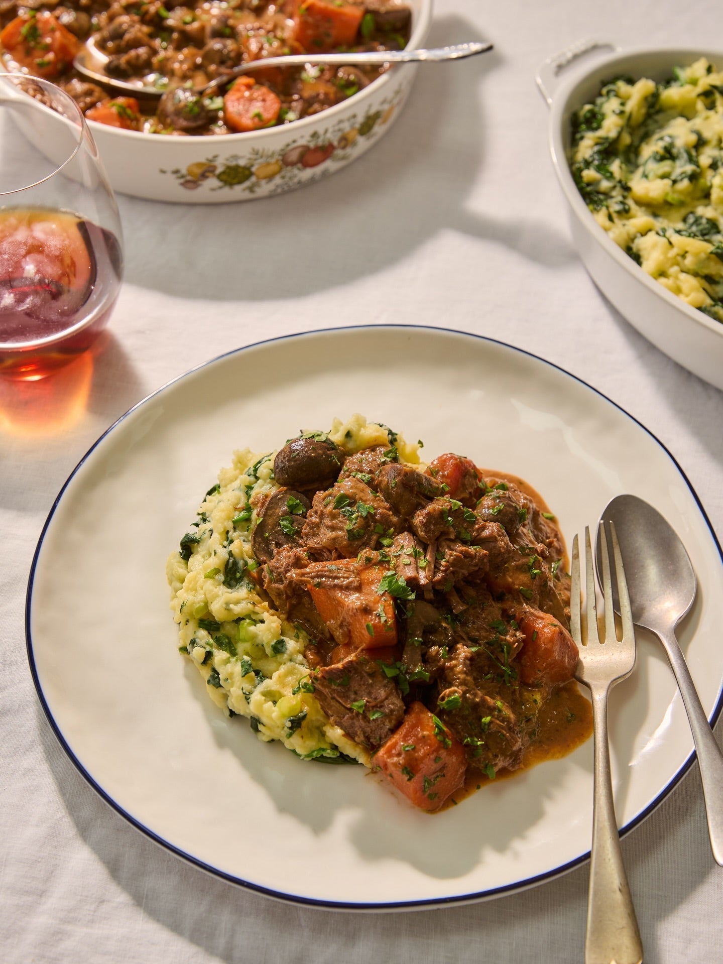 Steak Diane Casserole with a buttery bowl of colcannon